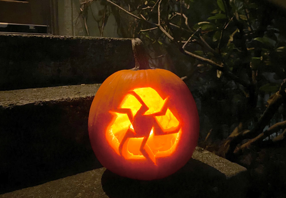 Green & Covid-safe Halloween header - image of jack-o-lantern carved with recycling arrows