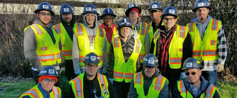 Operators in training wearing yellow vests, eye protection and hard hats at a King County treatment plant. Note: photo was taken prior to Covid mask protocols. 