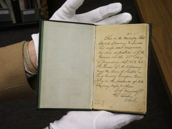 Photo of old book with handwritten record