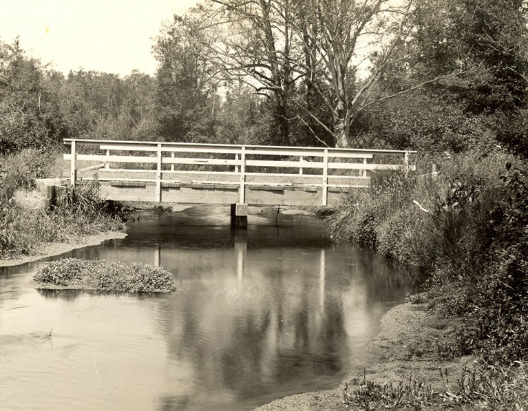 Wooden bridge across a river