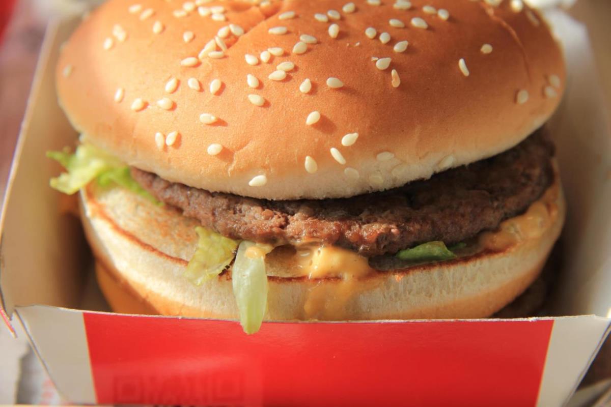 Fresh hamburger on a bun in a carton box