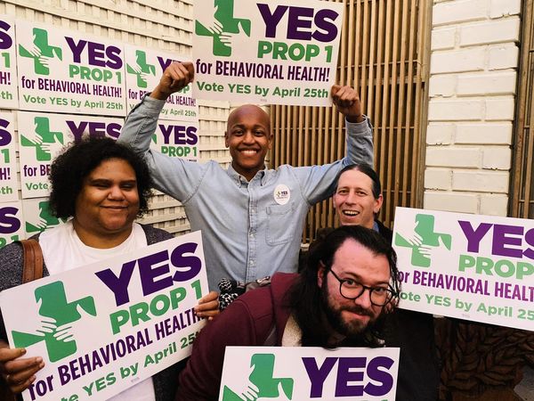 Councilmember Zahilay with levy supporters holding proposition 1 signs