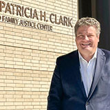 King County Councilmember Reagan Dunn in front of the Judge Patricia H. Clark Children and Family Justice Center building.