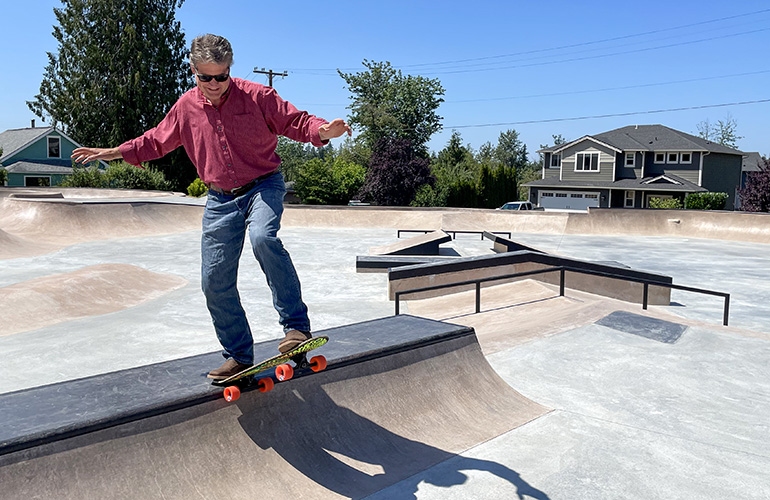 King County Councilmember Reagan Dunn testing out his skating skills at the newly completed Black Diamond Skatepark.