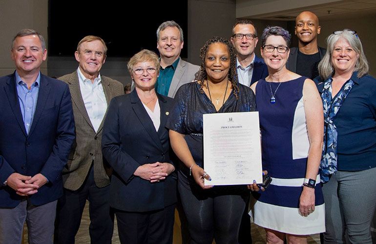 Councilmembers pose with Judge Elizabeth Berns and Teresa Anderson Harper, a Treatment Court graduate.