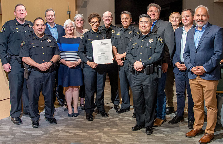 With police officers and councilmembers.