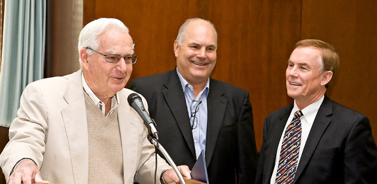 Three people at the podium.