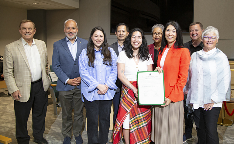 A group of County Councilmembers and community members receiving the AANHPI proclamation certificate.