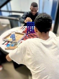 A youth plays Connect Four at the Clark Children and Family Justice Center.