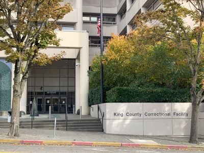 Street view of the entrance to the King County Correctional Facility building in Seattle