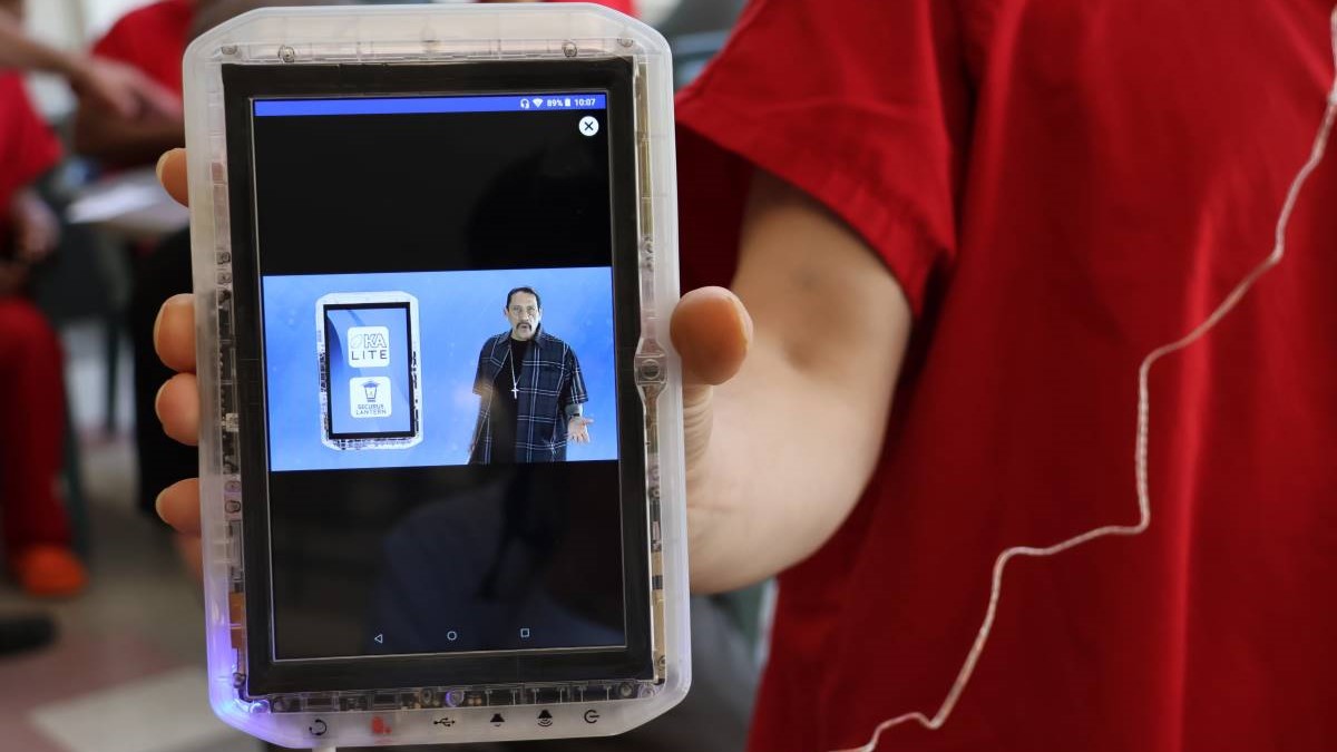 A resident at the Maleng Regional Justice Center in Kent hold a computer tablet that's now available at King County's secure detention facilities.