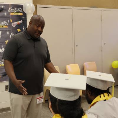 Assistant Principal Sullivan Shaw from Seattle's Interagency Academy addresses a high school graduation inside the King County Correctional Facility on June 25, 2024.