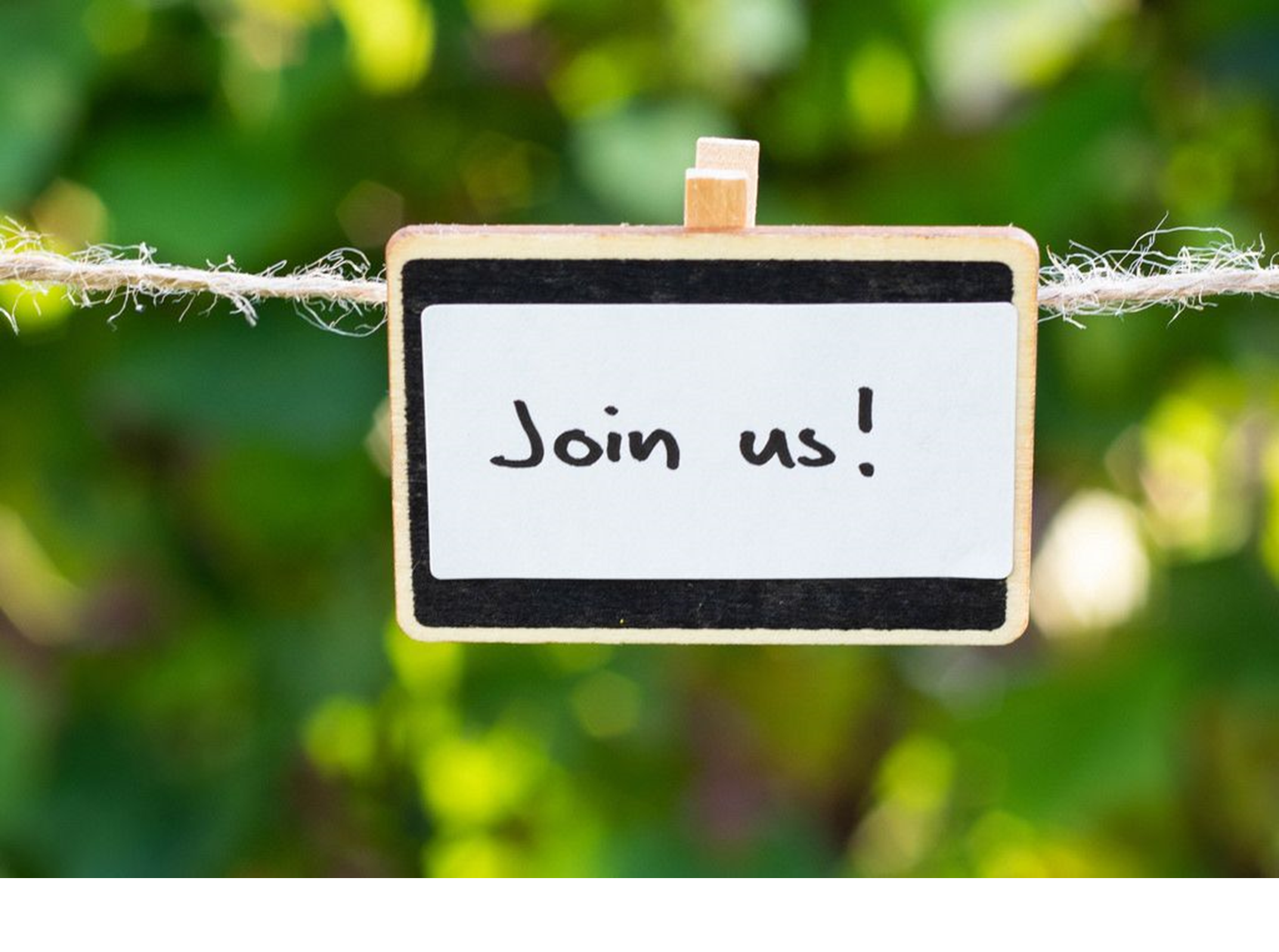 A hand-written sign that says "Join us" that's hanging outside.