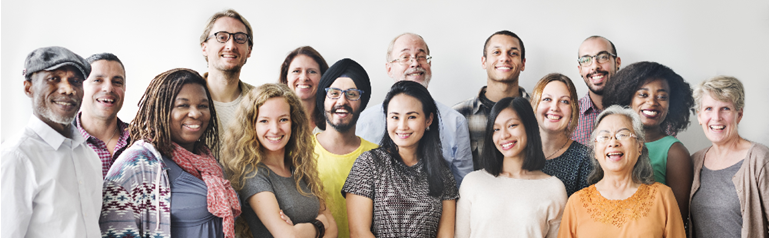A diverse group of smiling people of different races and ethincities standing shoulder to shoulder in 3 rows