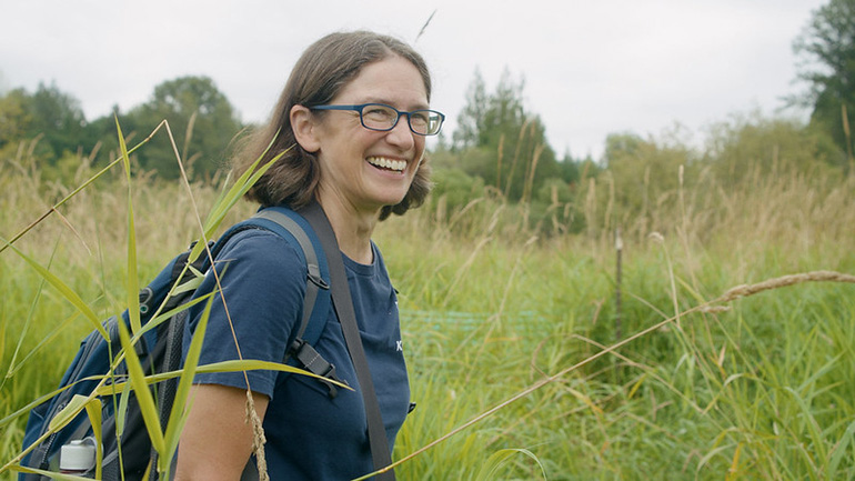 Ecologist Jen Vanderhoof smiling outdoors