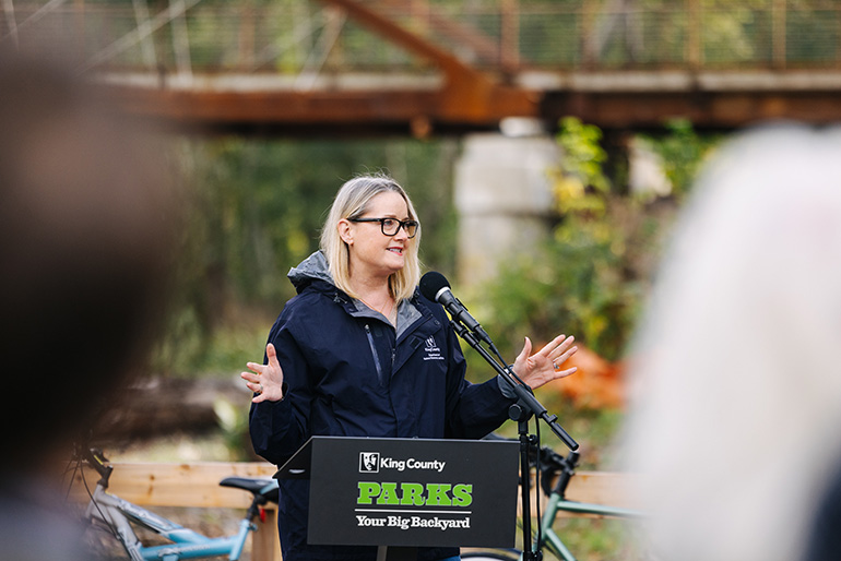 King County Deputy Executive Shannon Braddock leads the opening celebration of King County Parks new trail bridge crossing the White River