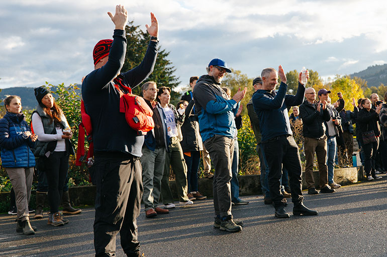 A crowd of people celebrate the release of kokanee into Lake Sammamish