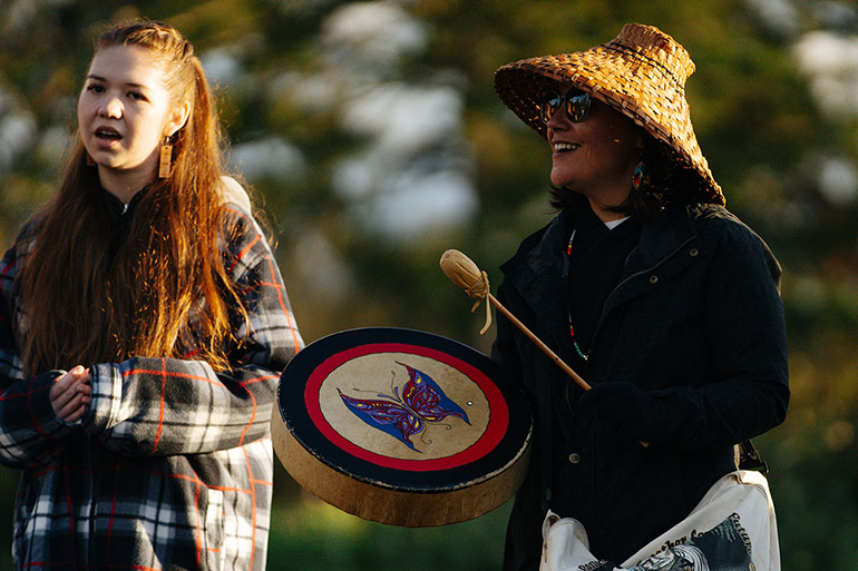 Members of the Snoqualmie Indian Tribe perform a song and blessing before releasing the young kokanee salmon into their ancestral waters.