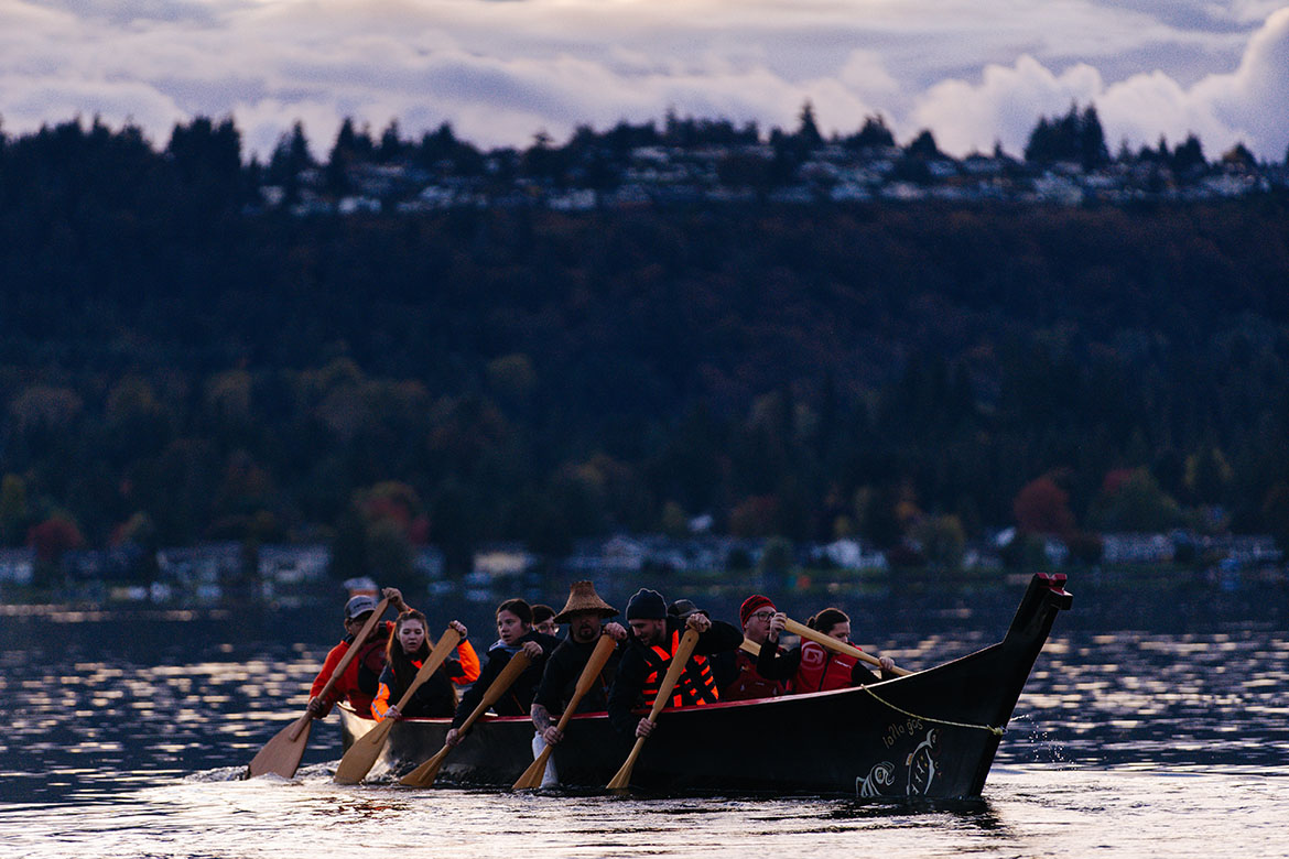 Members of the Snoqualmie Indian Tribe release the first of 12,000 young kokanee salmon near the middle of Lake Sammamish following a lakeshore celebration with partners coordinated by the King County Department of Natural Resources and Parks.