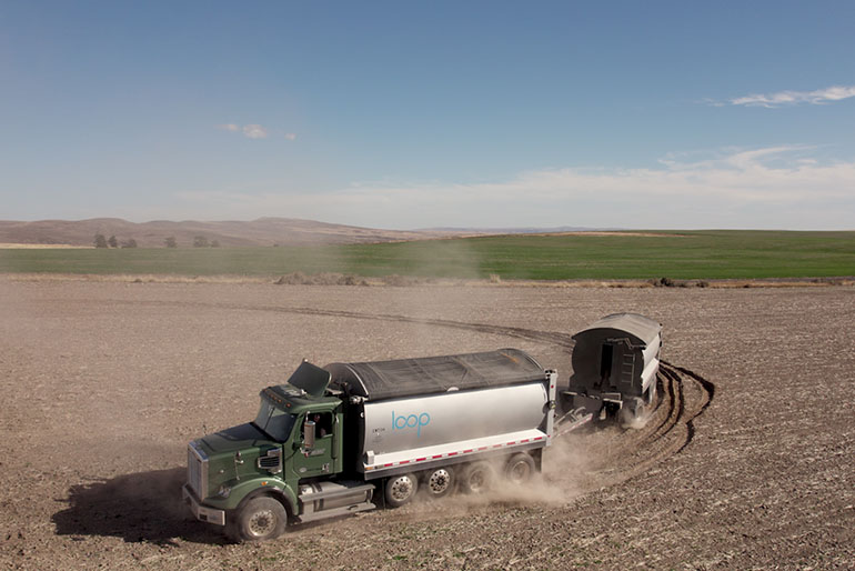 A Loop biosolids truck makes a delivery at a field in northern Douglas County.