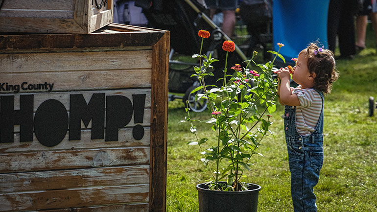 Child with flowers at a parks event