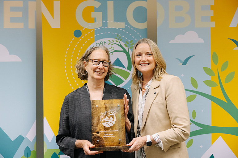 Lynda Mapes, recipient of the Environmental Catalyst Award, with King County Executive Shannon Braddock at the Green Globe Awards ceremony
