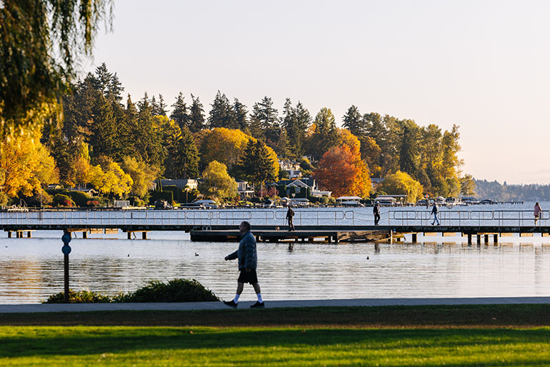 People walking on a path and dock at Juanita Beach Park on Lake Washington