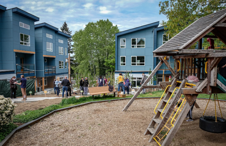 press conference near multifamily apartment buildings