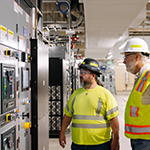 West Point Wastewater Treatment Plant operators checking backup battery controls
