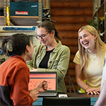 People socializing at a tool library