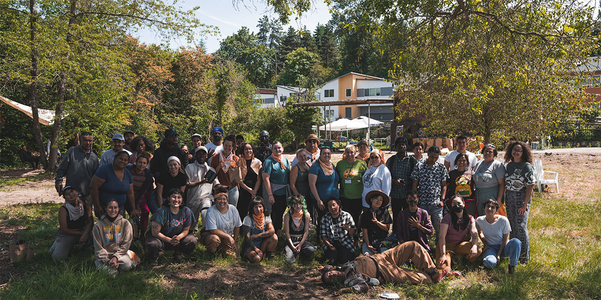 large group of community members pose for photo