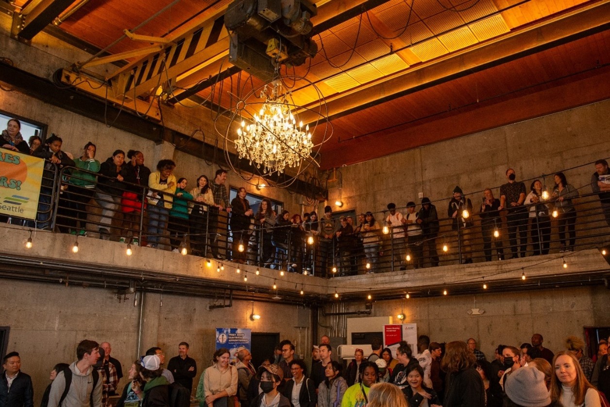 large group of people gathered in a conference hall
