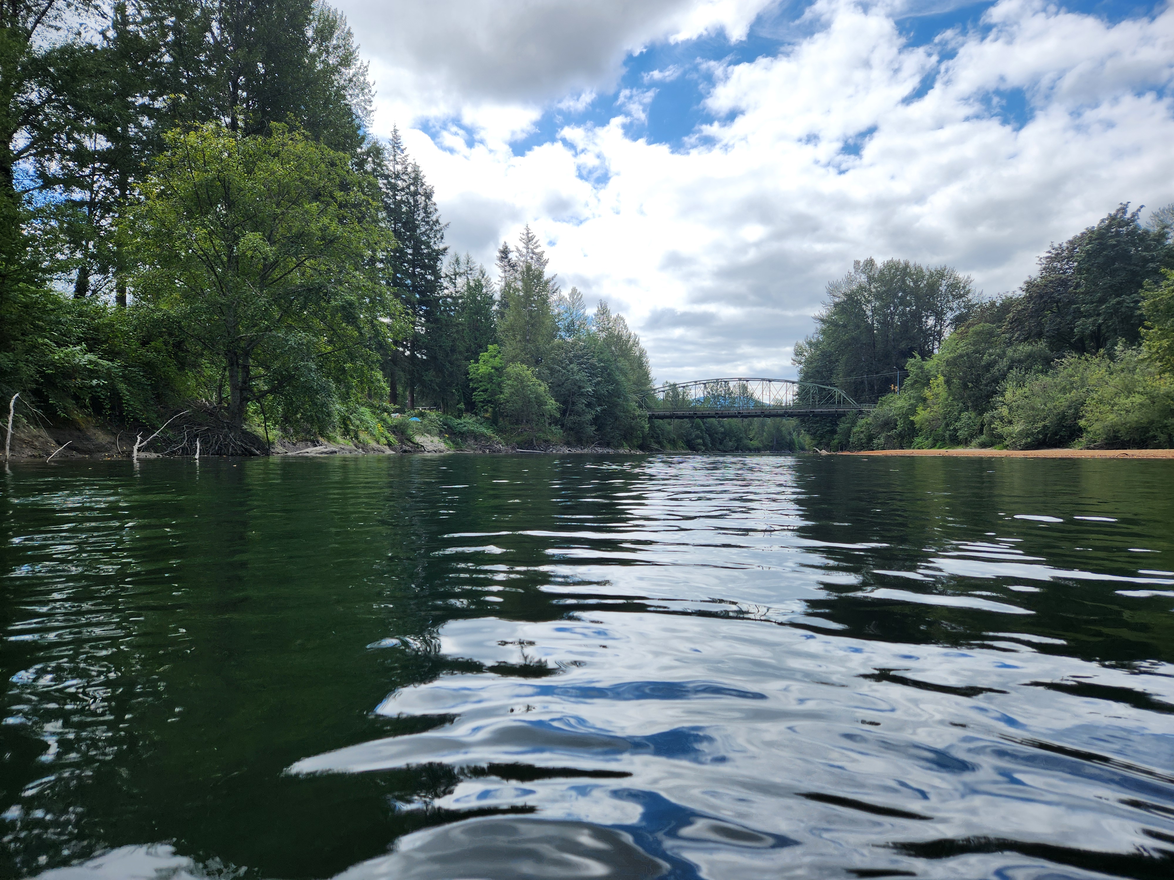 image from the Snoqualmie river with Meadowbrook bridge in the distance