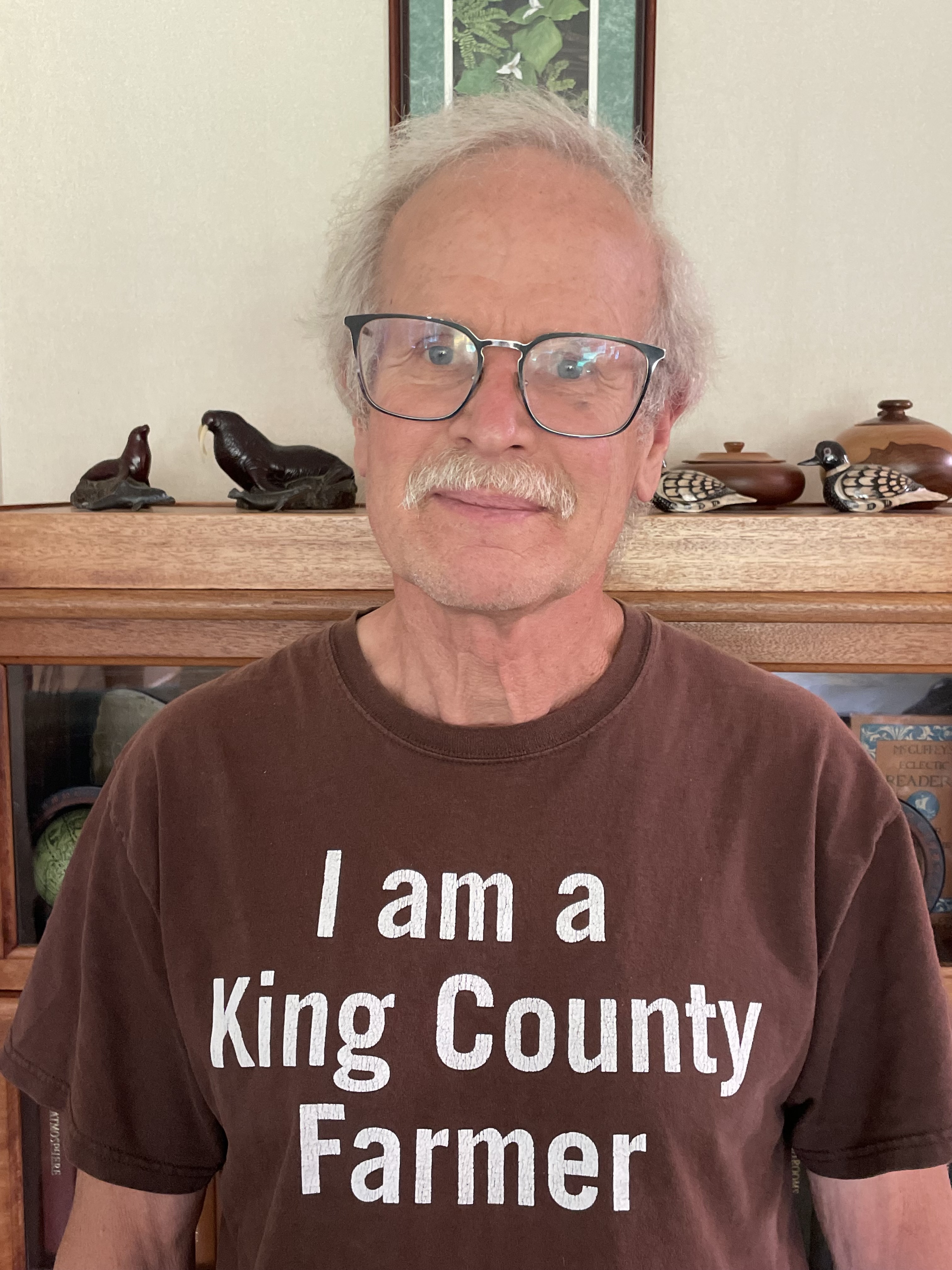 an older man wearing a t-shirt that says 
