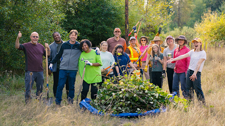 Work party in September 2025 battling weeds around Cemetery Pond