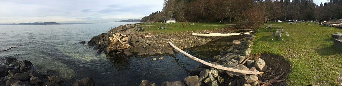 Heavily armored mouth of McSorley Creek and Puget Sound shoreline extending to the north