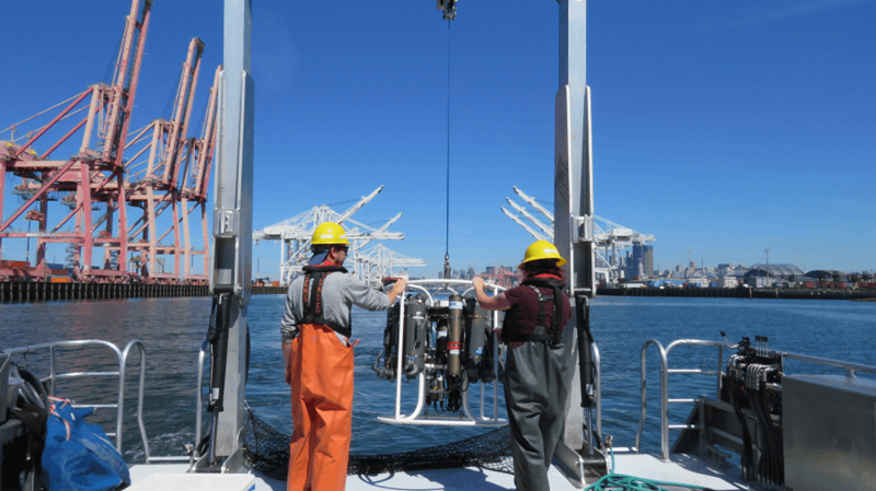 Marine scientists deploying oceanographic measurement equipment in Elliot Bay.
