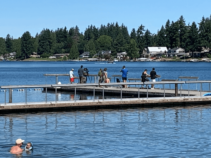 Photo of people fishing on a pier at Lake Meridian.