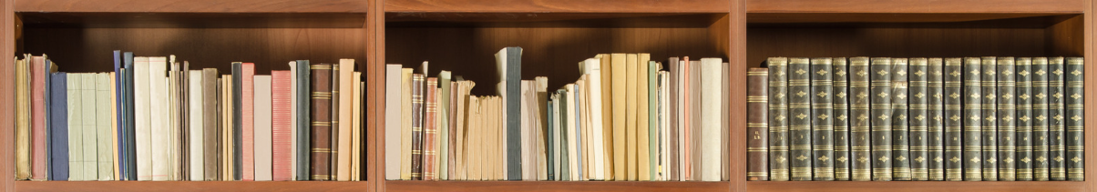 Decorative: A wooden bookshelf full of different books and documents