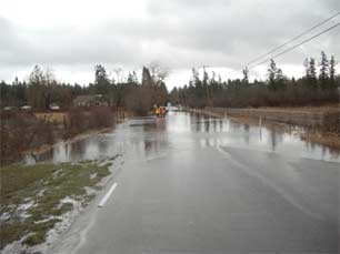 Water over a roadway by Allen Lake.