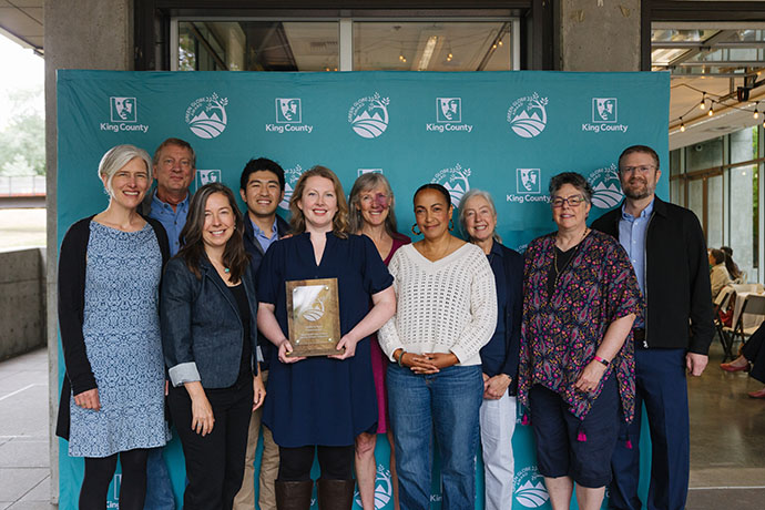 Volunteers on the King County Conservation Futures Advisory Committee are honored with the Leader in Land Conservation Green Globe Award