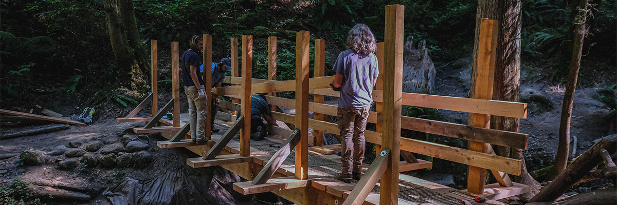King County backcountry trail crews build a bridge over a creek