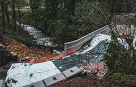 A bridge being constructed over Boise Creek
