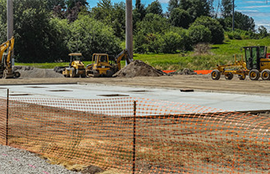 A concrete pad shows where a new playground will be in Skyway Park
