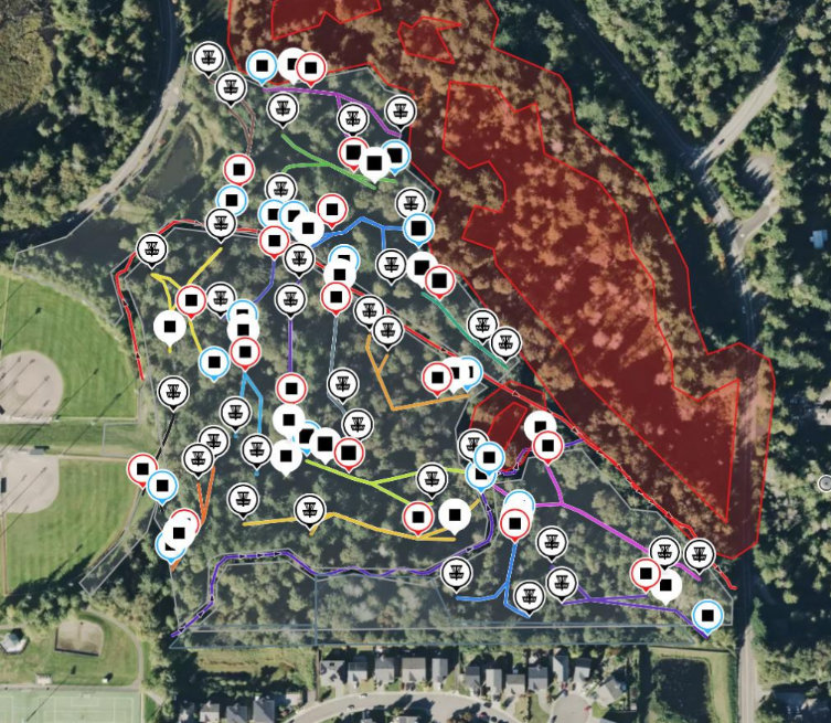 An aerial map of the proposed disc golf course. Little squares represent tee pads, and basket symbols are nearby