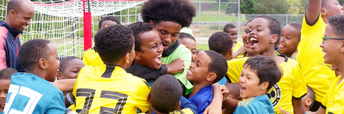 Young soccer players celebrate together