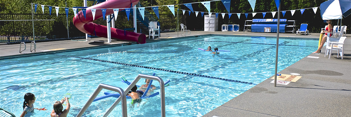 A group of kids play in the pool at Cottage Lake Park