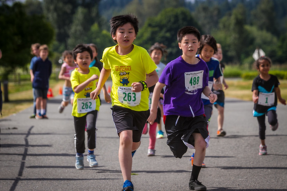 A group of kids run along a regional trail