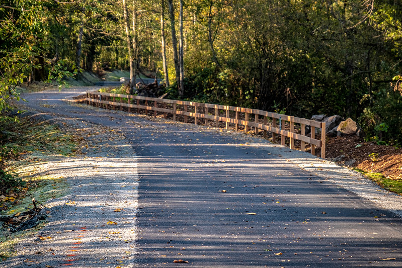 A wooden rail along the Foothills Trail