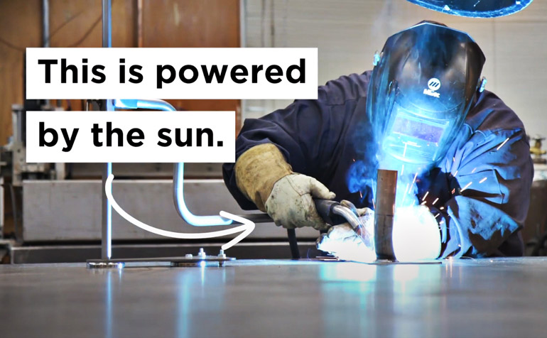 Image of a welder using a solar-powered welding device